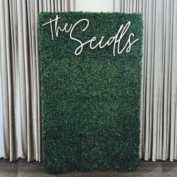 Lush Artificial Boxwood Hedge Wall rental for weddings and events, perfect for photos, ceremonies, and customizable decor accents.