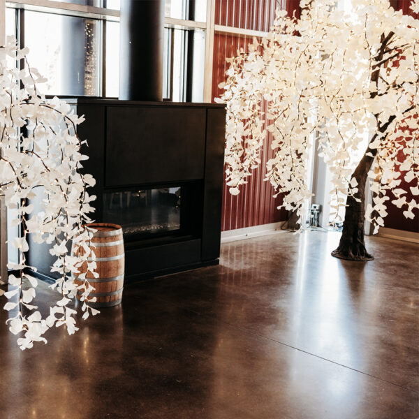 10-ft LED Weeping Willow Tree with cascading branches and soft glowing lights, perfect for wedding decor and indoor events.