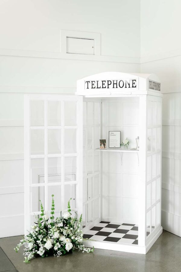 White British-style phone booth rental for weddings – perfect photo booth or audio guest book backdrop with no assembly required, elegant event decor.